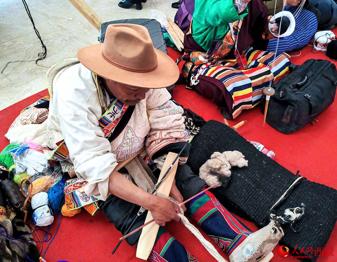 編織技能展示。人民網(wǎng) 李海霞攝