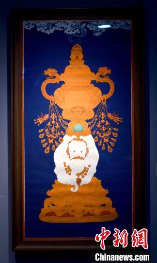 圖為5月16日，展覽中的新創(chuàng)唐卡作品《瑞象承香》?！±盍?攝